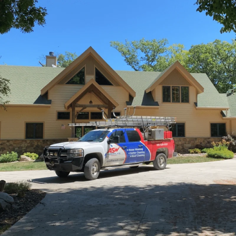 American Softwash service truck parked outside a home